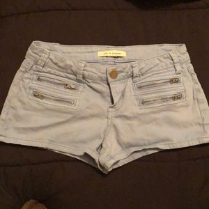 Light blue zipper shorts